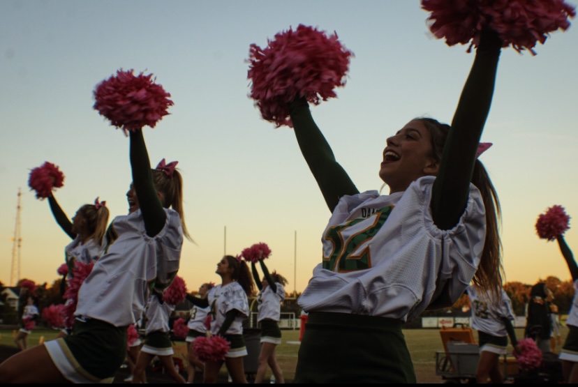 The Varsity Cheerleaders cheer on the team and get The Swarm loud.