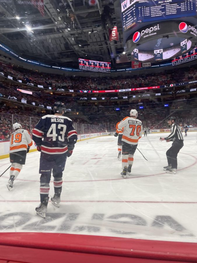 Wilson skates past Philadelphia Flyers starting goal in the first period. 