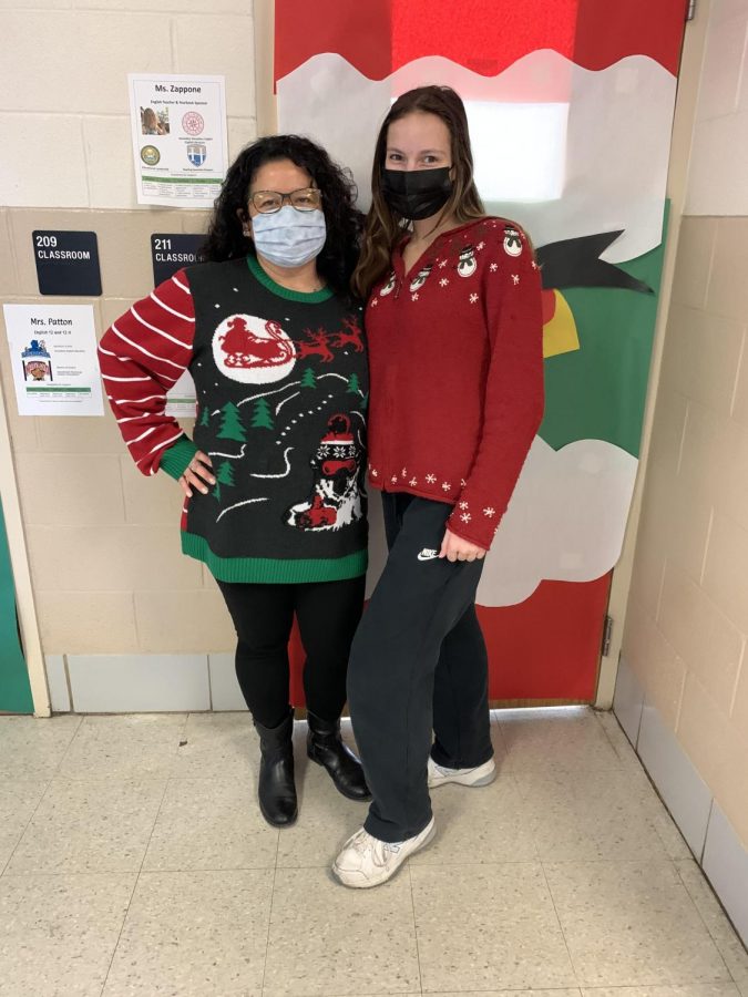 Megan Reese (12) and Mrs. Renehan show off their sweaters.