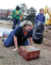 Investigators attempt to make sense of the treasures found in two boxes beneath the statue of Robert E. Lee that was recently removed in Richmond.