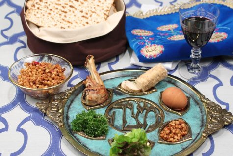 The traditional passover seder plate consists of parsley, charoset, karpas, a hard boiled egg, shank bone, three matzo and salt water.