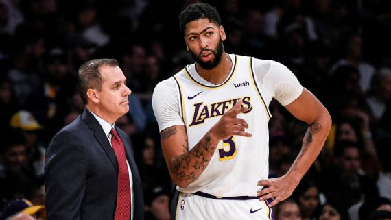 Vogel and Anthony Davis discussing plays on the sideline.