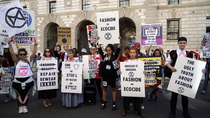 People protest against the fast fashion industry, which has come under scrutiny by environmentalists.