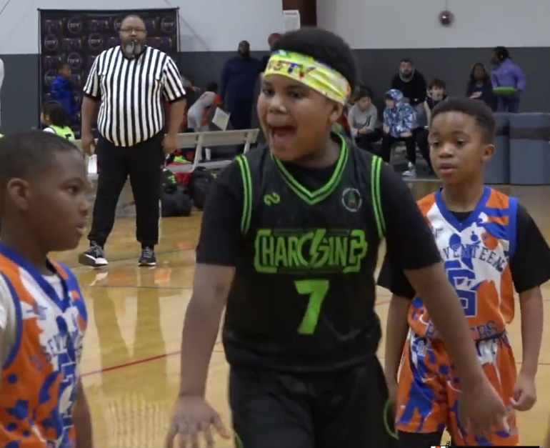 A third grader featured on Overtime seen taunting his opponent after an and-one layup.