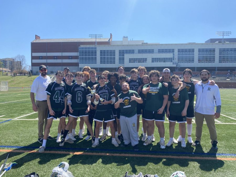 The Boys Varsity Lacrosse team celebrates after winning the Guck Cup Spring Break Championship. Photo by Emalie Jaramillo
