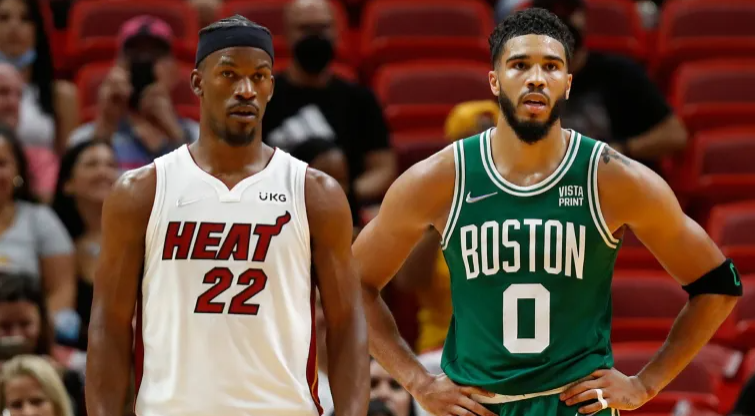 Jimmy Butler of the Miami Heat, winner of this years Larry Bird Award, stands next to Jayson Tatum during the Eastern Conference Finals.
