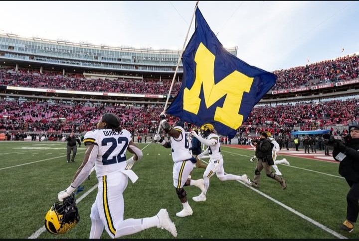 Michigan football storming Ohio State's field after the upset